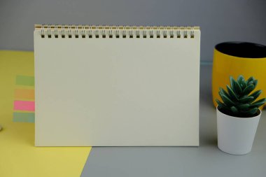 blank paper next to school tools with no word as a template for text space concept. business and education concept