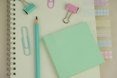 blank paper next to school tools with no word as a template for text space concept. business and education concept