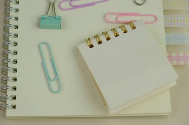 blank paper next to school tools with no word as a template for text space concept. business and education concept