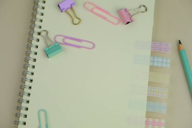 blank paper next to school tools with no word as a template for text space concept. business and education concept