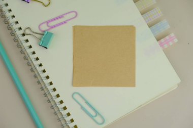 blank paper next to school tools with no word as a template for text space concept. business and education concept