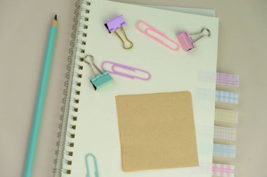 blank paper next to school tools with no word as a template for text space concept. business and education concept