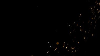 Sağ üst köşeden koyu siyah bir zemine doğru düşen parlak kıvılcımlar ve közler video kaplamaları için güzel bir soyut parçacık hareketi efekti yaratıyor