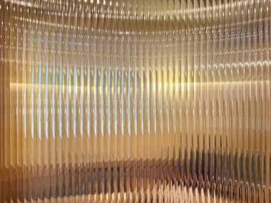 Flütlü camların veya çizgili camların, altın arka planların kırılması ve arkasında sarı ışıkların kırılması ile yakın dokusu. Flütlü cam estetik açıdan güzeldir. Kusursuz arkaplan dokusu.