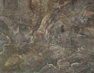 Düz olmayan üç boyutlu doğal koyu gri ve kahverengi doğal taş granite yakın çekim. Kabataslak yüzeyi ve duvar ve zemin için uygun deseni olan mineral taşları. Kusursuz arkaplan dokusu