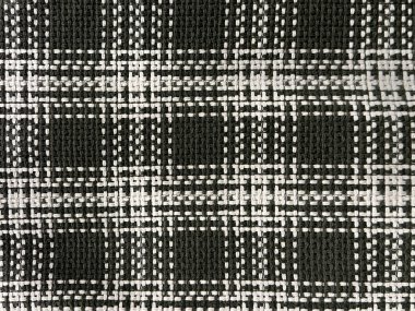 Tartan desenli kumaşı kapat. Siyah ve beyaz renkte. Flanel ya da tartan tarzı fular, gömlekler ve moda endüstrisinde çok yaygındır. Kusursuz arkaplan dokusu.