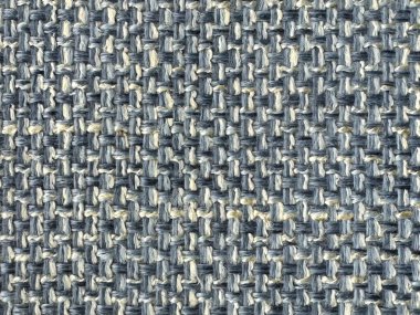 Örülmüş pamuk ve polyesterden yapılmış mavi döşeme kumaşının yakın dokusu. Mikro keten örülmüş doku. Kanepe, döşeme, perde ve kumaş için uygun. Kusursuz arkaplan kumaş dokusu.