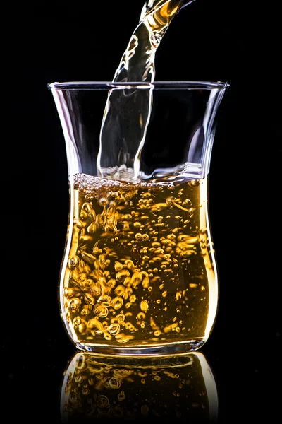 Pouring green tea in a glass — Stock Photo, Image