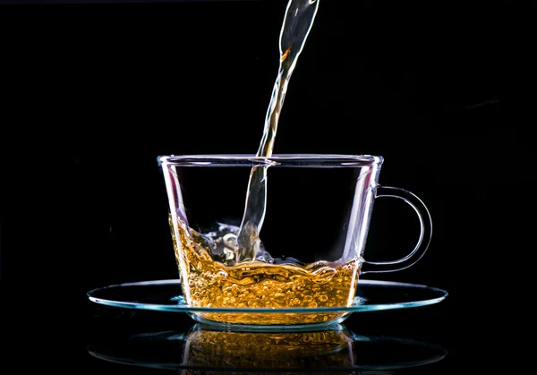 Pouring green tea in a glass — Stock Photo, Image