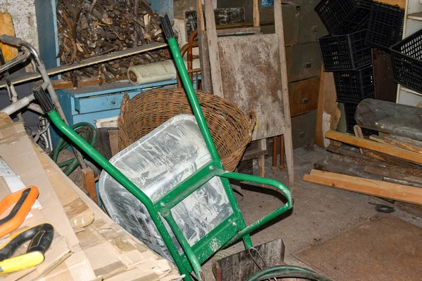 A cluttered farmhouse outbuilding or utility room in a rural household