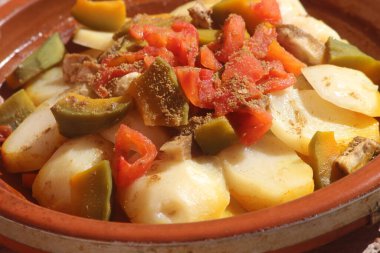 A close-up shot of a fresh moroccan tajine with vegetables