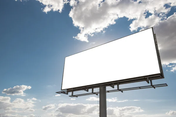 Empty billboard in front of beautiful cloudy sky in a rural location Royalty Free Stock Photos