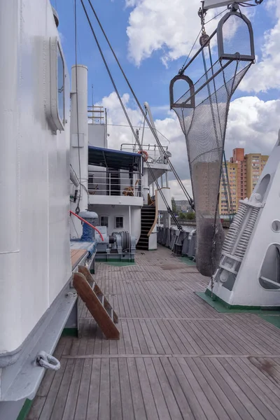 upper deck of nautical vessel with cityscape view