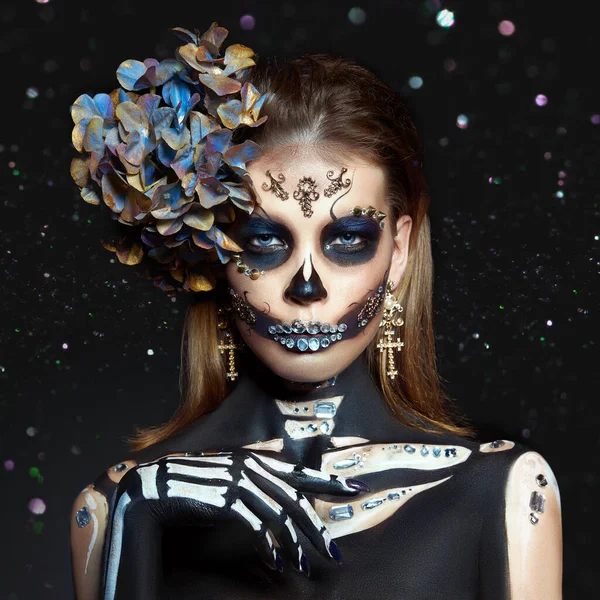 Halloween beauty skeleton woman makeup face Bokeh glitter. Girl death Halloween costume. Day of The Dead. Charming and dangerous Calavera Catrina