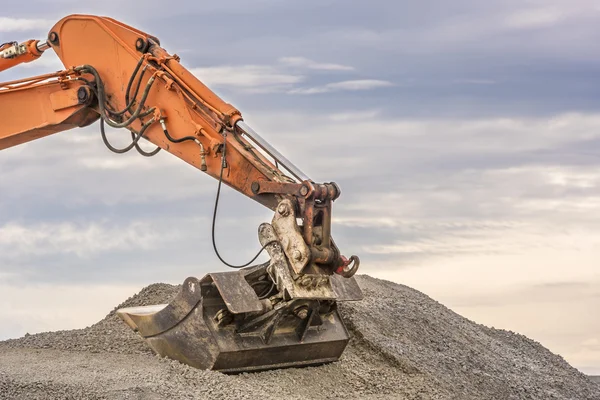 Hydraulic excavator climbed on a ballast pile — Stock Photo ...