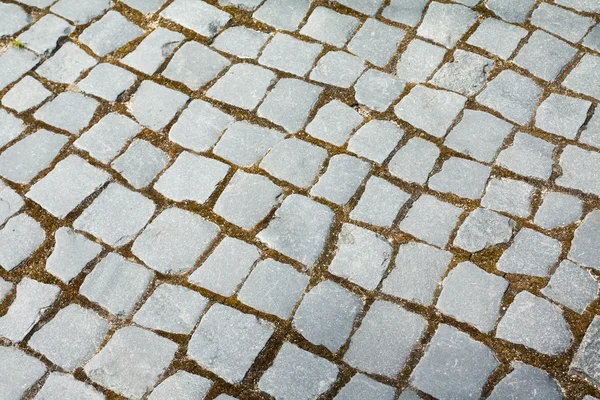 Fondo estructurado abstracto de un viejo patrón de losas de pavimento de calle — Foto de Stock
