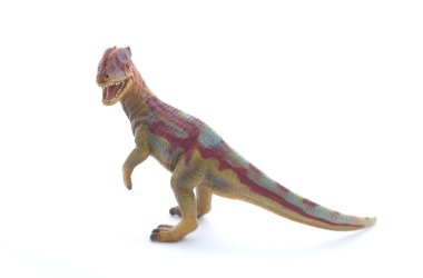 Beyaz bir arka plan üzerinde oyuncak dinozor