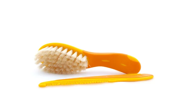 Conjunto de duas escovas de cabelo de bebê laranja em um fundo branco — Fotografia de Stock