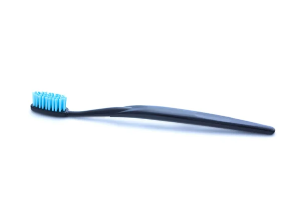 Escova de dentes preta no fundo branco — Fotografia de Stock