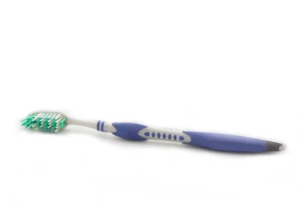 Blå tandborste på vit bakgrund — Stockfoto