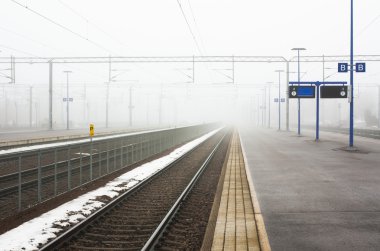 Kouvola, Finland 31 March 2016 - Kouvola railway station in fog. clipart