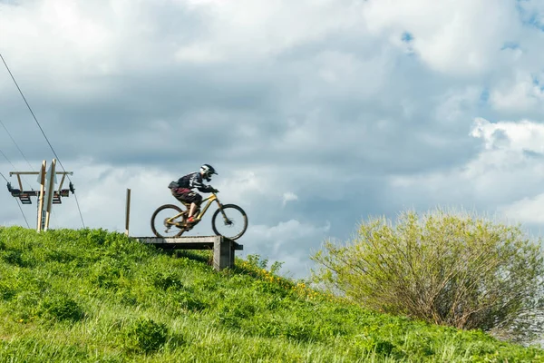 Mountain Biker Jumping Drop Royalty Free Stock Images