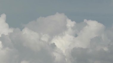 Time-lapse video of cumulus clouds forming beneath a bright blue sky