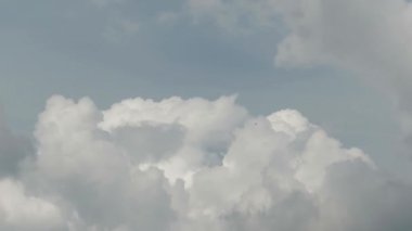 Time-lapse video of cumulus clouds forming beneath a bright blue sky