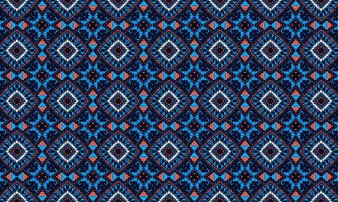 Mavi, beyaz ve mercan renklerinde geometrik şekilleri olan kusursuz bir kabile deseni, tekstil tasarımı için harika.