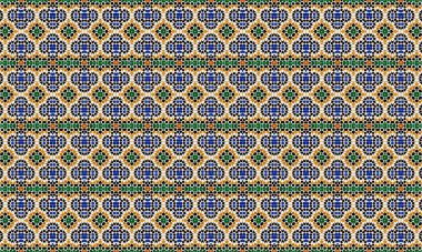 Renkli ve karmaşık bir geometrik desen. Beyaz arka planda mavi, yeşil, turuncu ve siyah renkleri tekrarlayan şekiller..