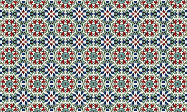 Renkli ve karmaşık bir çiçek deseni. Kırmızı, mavi ve yeşil şekiller beyaz arka planda tekrarlanan bir dizayn..