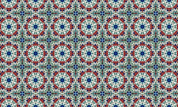 Mavi, kırmızı ve yeşil şekilli canlı ve karmaşık bir çiçek deseni beyaz arka planda tekrarlanan bir dizayn..