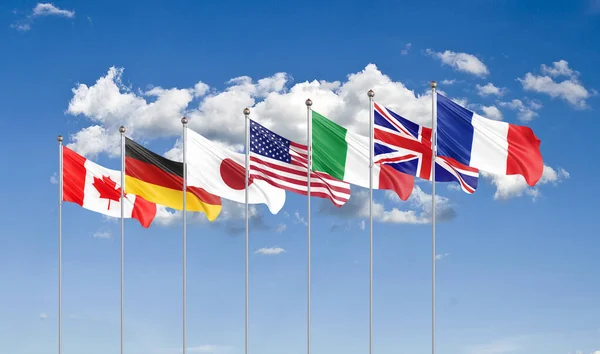 Büyük Yedi. G7 bayrakları Yedi Kanada, Almanya, İtalya, Fransa, Japonya, ABD, Birleşik Krallık 2019 ülkelerinin bayraklarını sallıyordu. Bulut arkaplanı. 3B illüstrasyon.