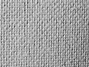 Bu, çeşitli arkaplan ve tasarım projeleri için mükemmel olan gri dokulu bir kumaşın detaylı bir görüntüsüdür.