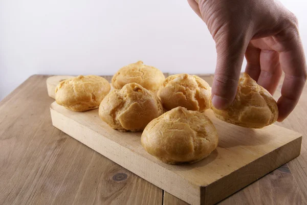 Profiteroles decorated with mint leaves