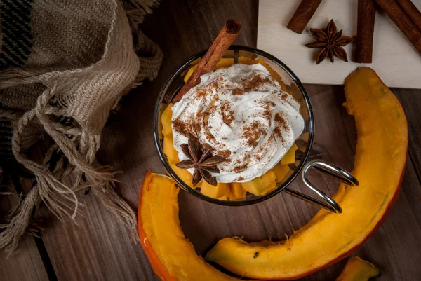 Pumpkin latte with whipped cream and spices