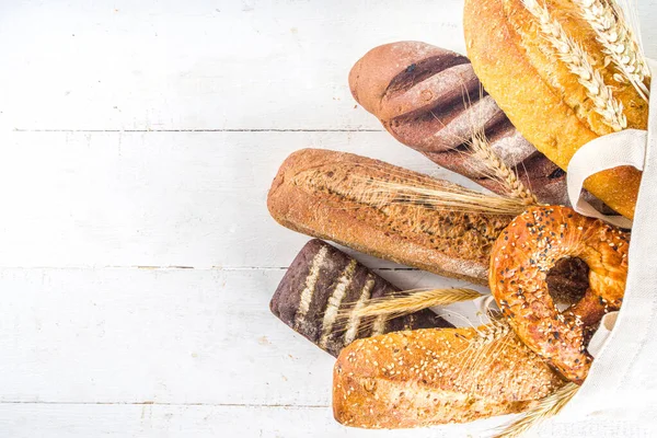 Assortment Various Delicious Freshly Baked Bread White Background Top View — Stock Photo, Image