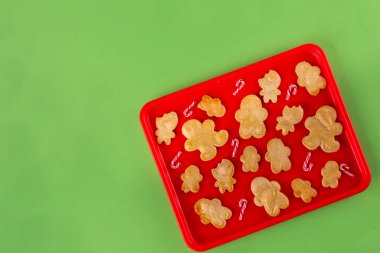 Christmas cookies background with various gingerbread man biscuits and sugar sprinkles, Christmas, New Year baking cooking. Making festive Christmas sweet cookies, Christmas baking sale background 