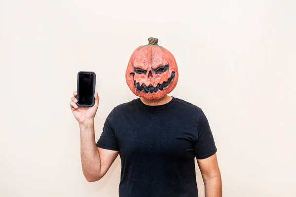 Man Pumpkin Mask Using Smart Phone — Stock Photo, Image