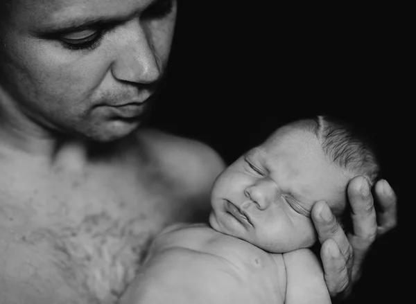 Newborn baby with dad.