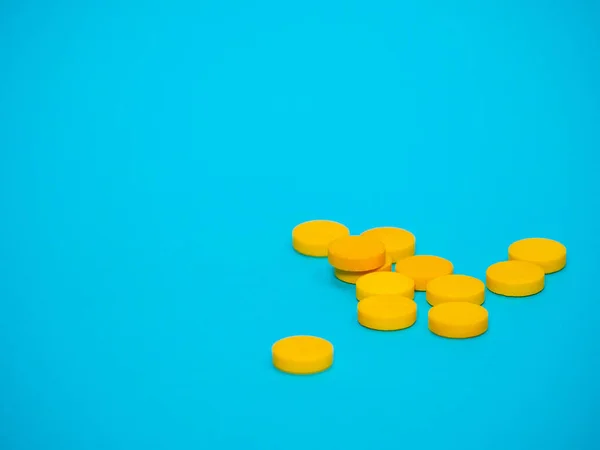Mavi arka planda sarı haplar