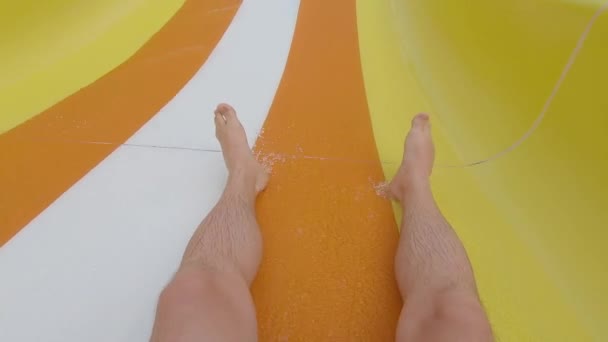 Unrecognizable male person riding water tube slide in aquapark — Stock Video