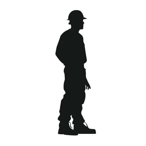Koyu renk siluetli biri ayakta duruyor. Sert bir şapka, gömlek, pantolon ve ayakkabı giyiyorlar. İnsan sağa bakıyor ve kalçasında bir el var..