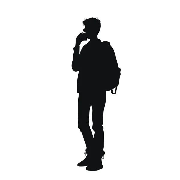 Genç bir adam siluette tasvir ediliyor, ayakta duruyor ve akıllı bir telefonla konuşuyor. O bir ceket giyiyor ve bir sırt çantası taşıyor. Arkaplan düz beyaz.