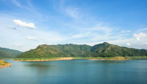 Water Storage Dam In the morning , a mountain And the blue sky.