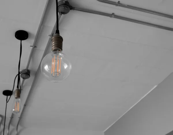 Edison\'s light bulb and lamp in modern style. Warm tone light bulb lamp. Lamps in coffee shop.