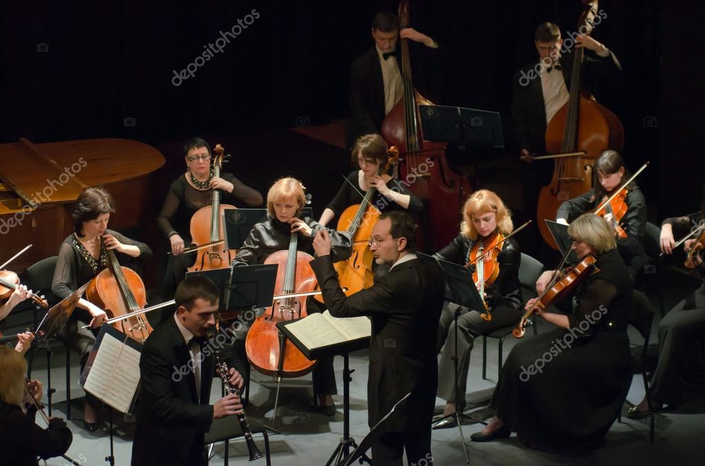 DNIPROPETROVSK, UKRAINE - MARCH 9: FOUR SEASONS Chamber Orchestra - main conductor Dmitry Logvin perform at the State Russian Drama Theatre on March 9, 2015 in Dnipropetrovsk, Ukraine