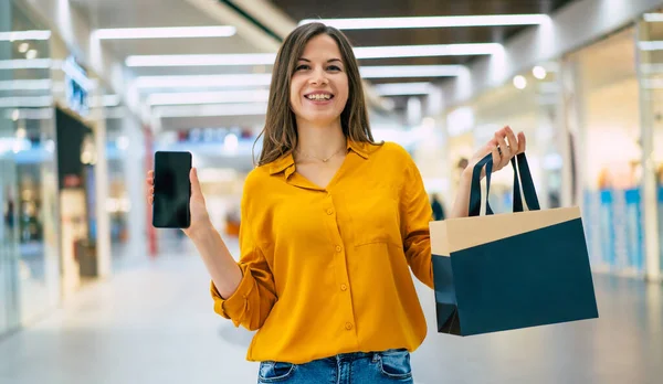 Happy Beautiful Young Stylish Woman Shopping Bags Using Smart Phone — Stock Photo, Image