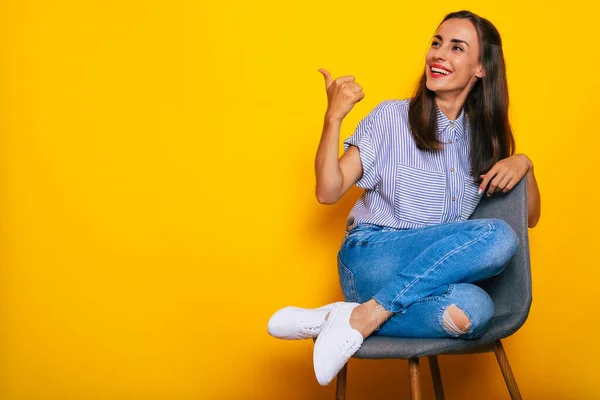 Cute Smiling Stylish Woman Sitting Chair Posing Isolated Yellow Background — Stock fotografie