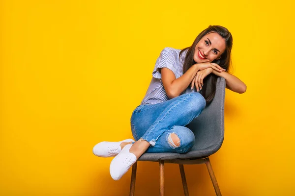 Cute Smiling Stylish Woman Sitting Chair Posing Isolated Yellow Background — Stock Fotó